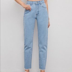 A pair of light wash mom jeans.